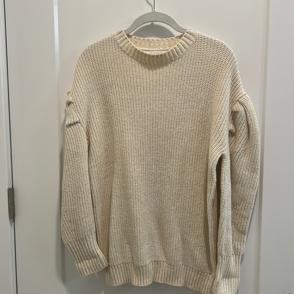 Cream sweater with puff sleeve detail